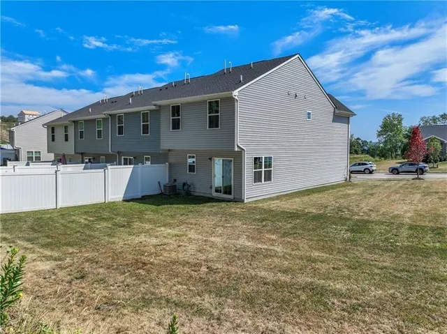 an aerial view of a city with mountains
