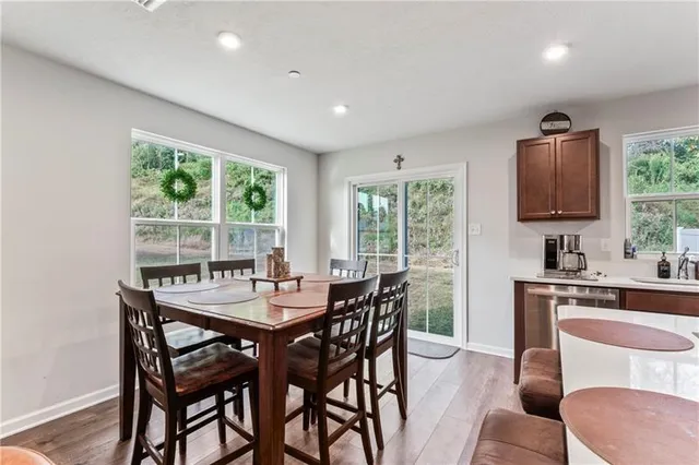 a view of a dining room with furniture window and outside view