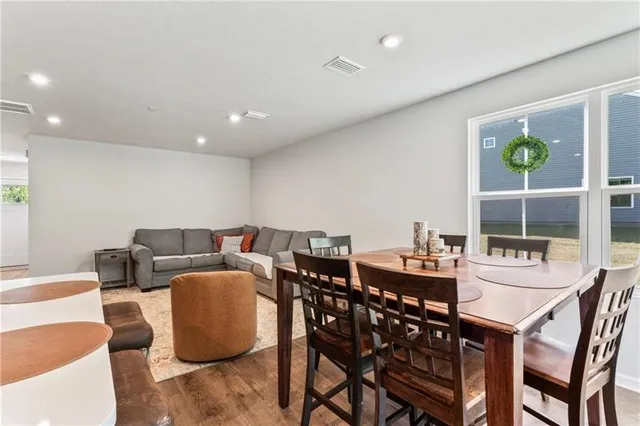 a dining room with furniture and window