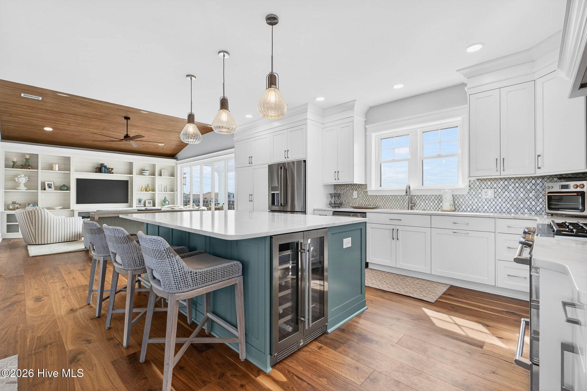 1416 Riverside Drive Sunset Beach, NC 28468 - Photo 6 of 83 Bright open-concept kitchen with large island and designer lighting perfect for entertaining in this canal-front property.