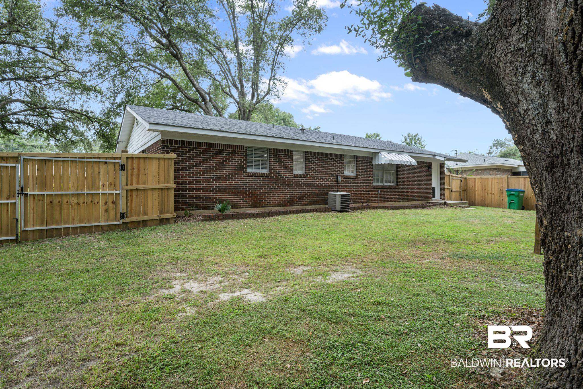621 Ann Street Saraland, AL 36571 - Photo 18 of 21 Exterior space with central AC unit