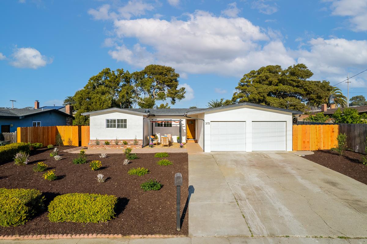 3173 Shuler Circle Marina, CA 93933 - Photo 1 of 55 a front view of a house with a yard and garage