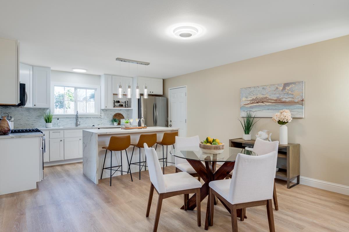 3173 Shuler Circle Marina, CA 93933 - Photo 19 of 55 a dining room with furniture and wooden floor