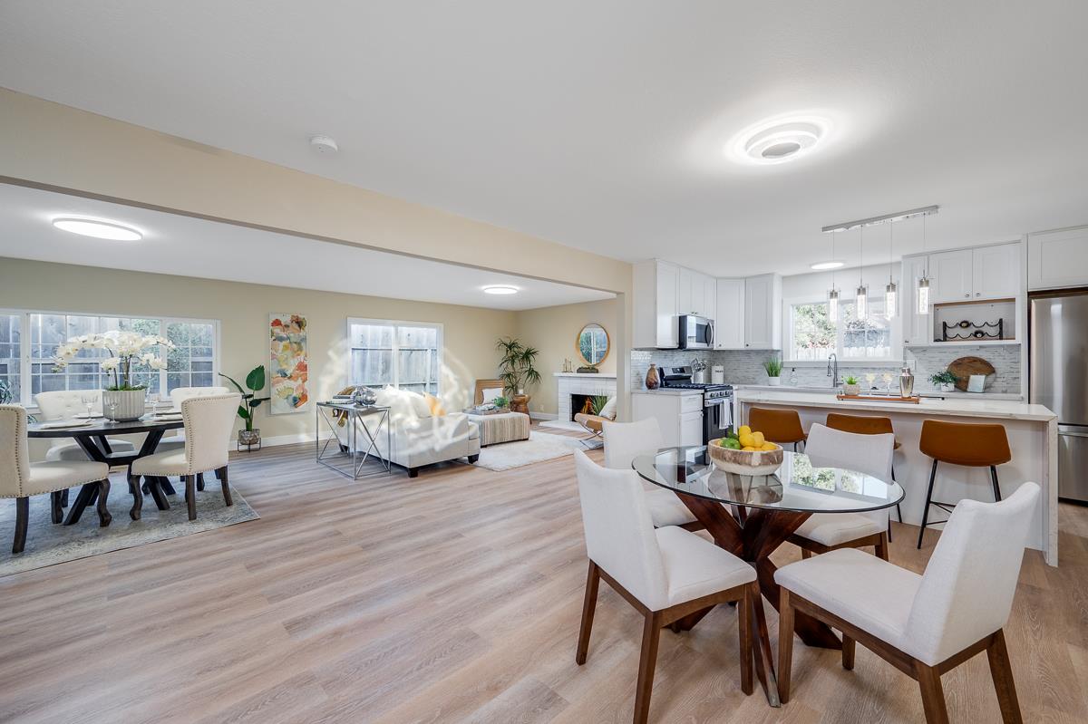 3173 Shuler Circle Marina, CA 93933 - Photo 20 of 55 a living room with furniture and a dining table with wooden floor