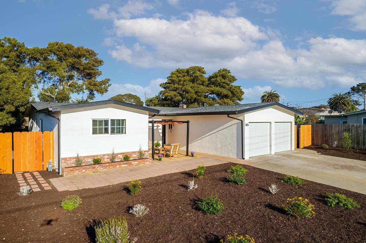 3173 Shuler Circle Marina, CA 93933 - Photo 2 of 55 a front view of a house with a yard and garage
