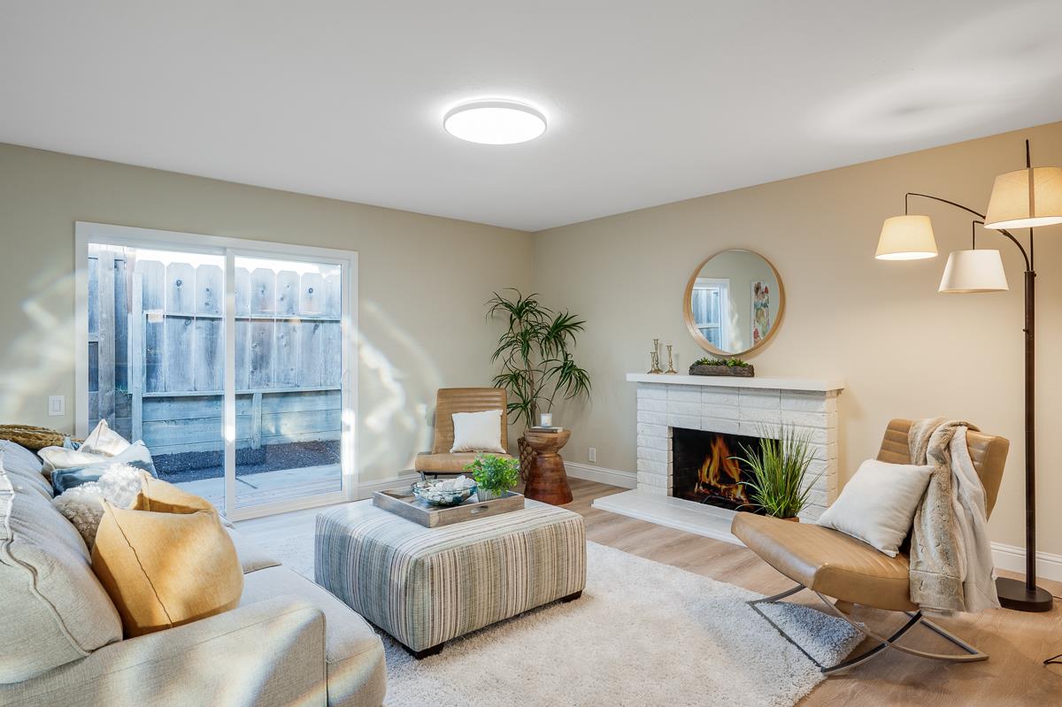 3173 Shuler Circle Marina, CA 93933 - Photo 25 of 55 a living room with furniture and a fireplace
