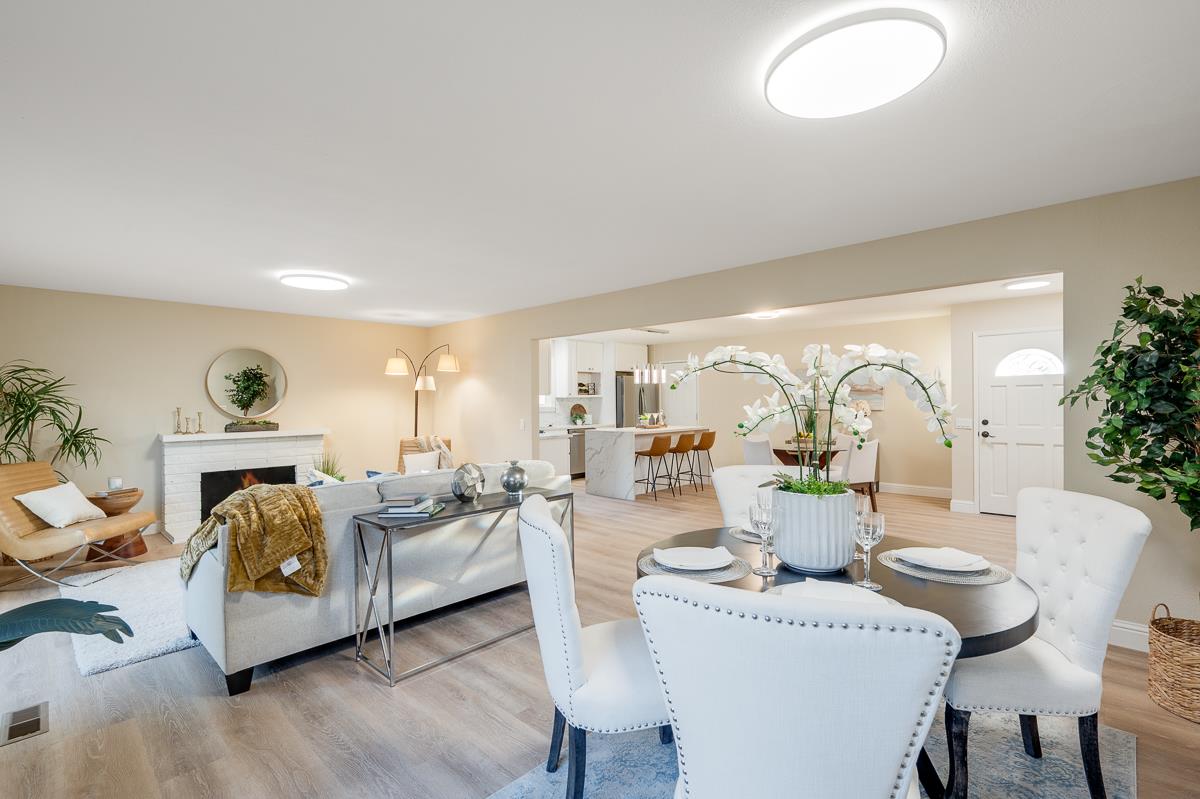 3173 Shuler Circle Marina, CA 93933 - Photo 31 of 55 a living room with furniture a fireplace and a potted plant