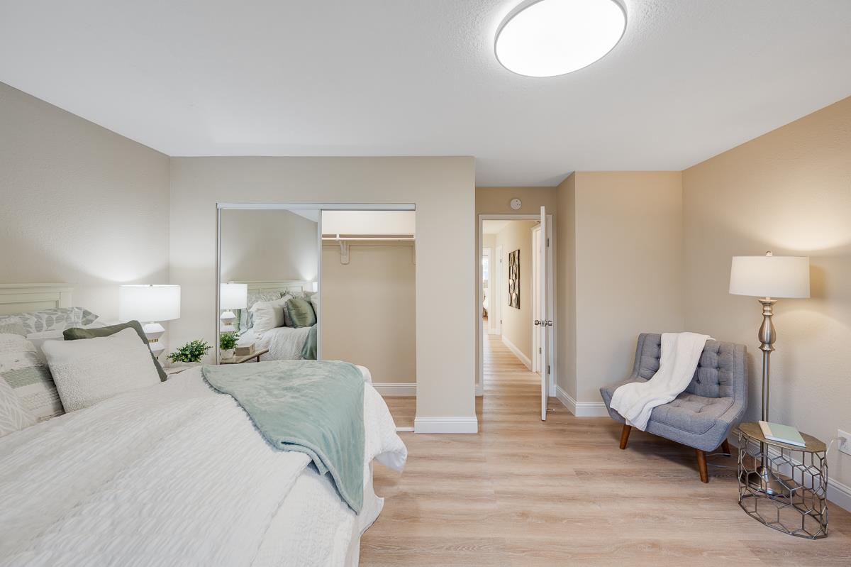 3173 Shuler Circle Marina, CA 93933 - Photo 36 of 55 a spacious bedroom with a bed and a lamp