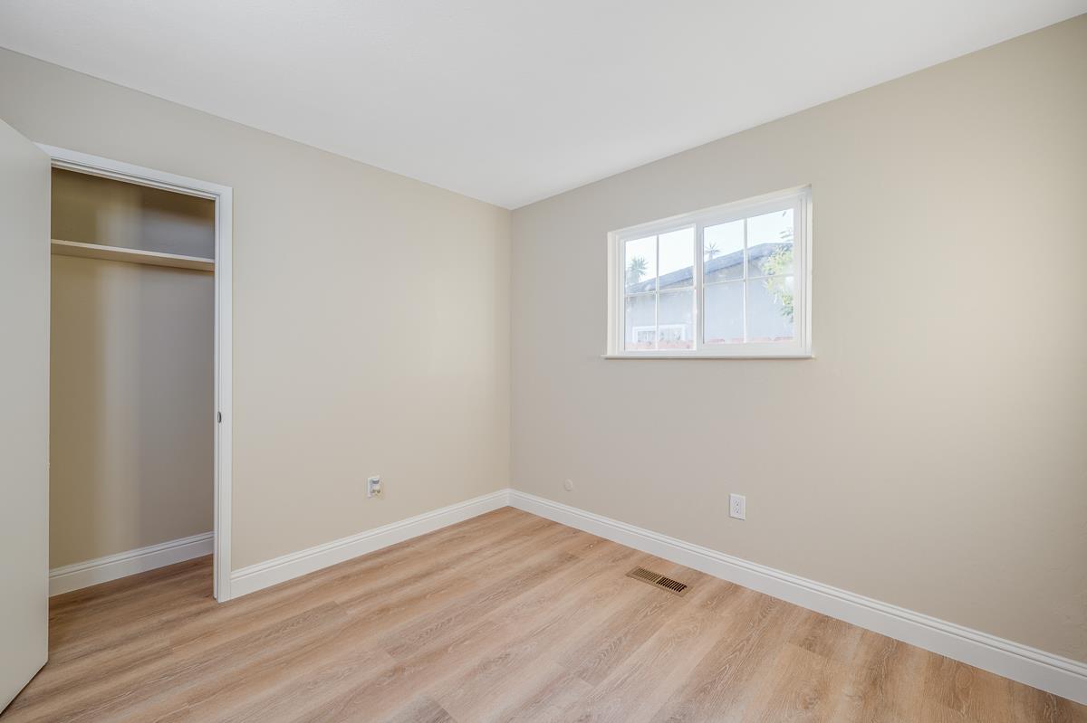 3173 Shuler Circle Marina, CA 93933 - Photo 45 of 55 an empty room with wooden floor and windows