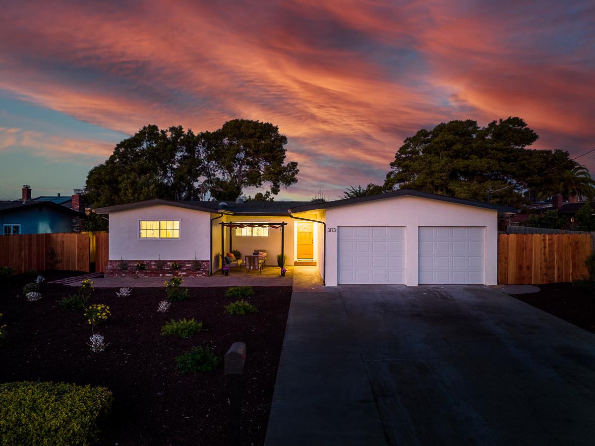 3173 Shuler Circle Marina, CA 93933 - Photo 54 of 55 a view of a street that has big trees and a car parked in front of it
