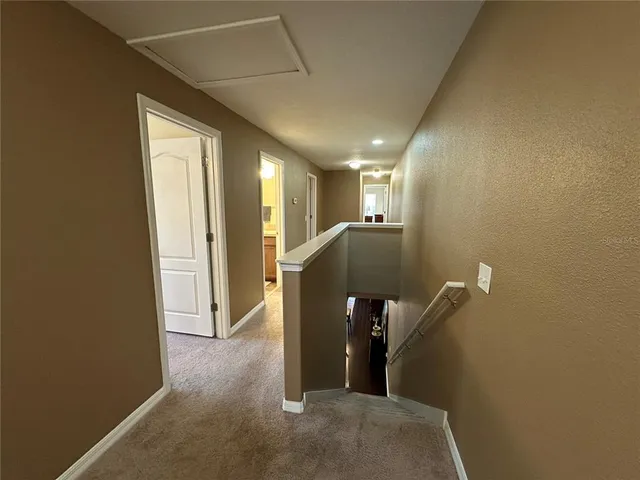 a view of a hallway with closet