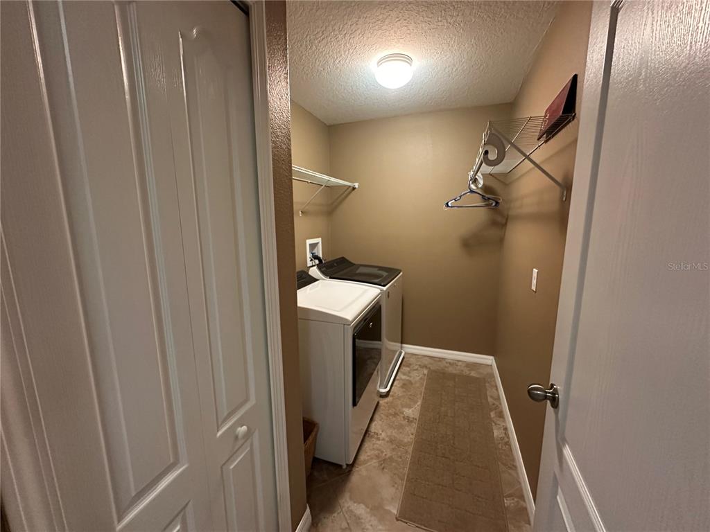 9476 Trumpet Vine Loop Trinity, FL 34655 - Photo 14 of 19 a bathroom with a sink and toilet