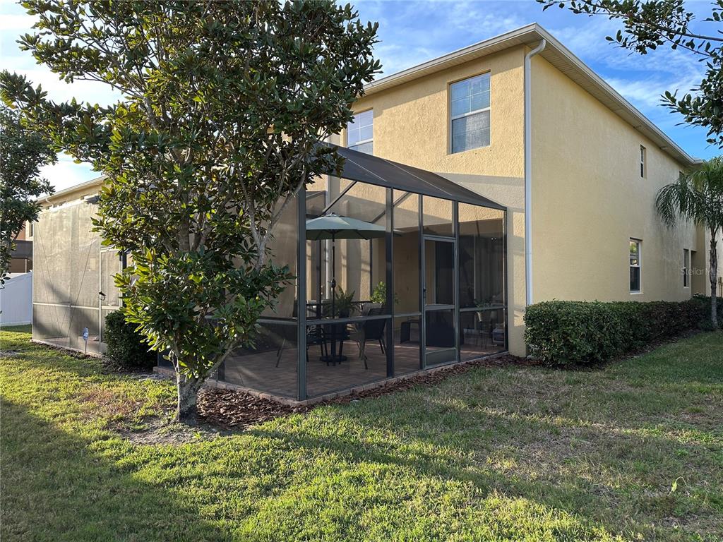 9476 Trumpet Vine Loop Trinity, FL 34655 - Photo 19 of 19 a front view of a house with garden