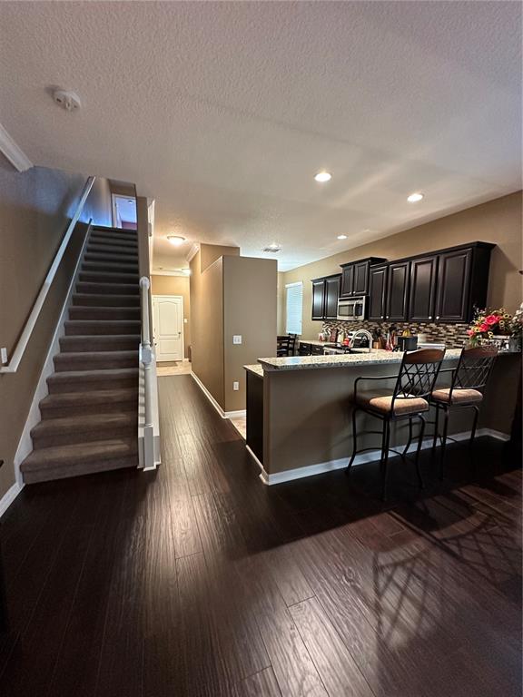9476 Trumpet Vine Loop Trinity, FL 34655 - Photo 5 of 19 a living room with furniture and a wooden floor