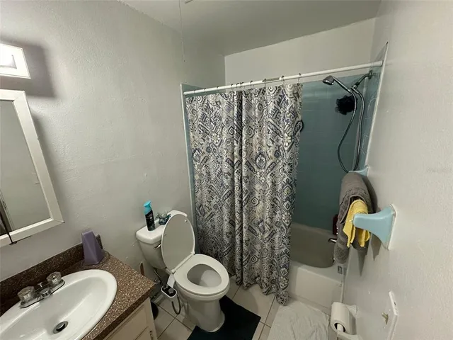 a view of city with tall trees