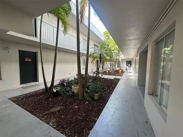 a view of a pathway with a backyard