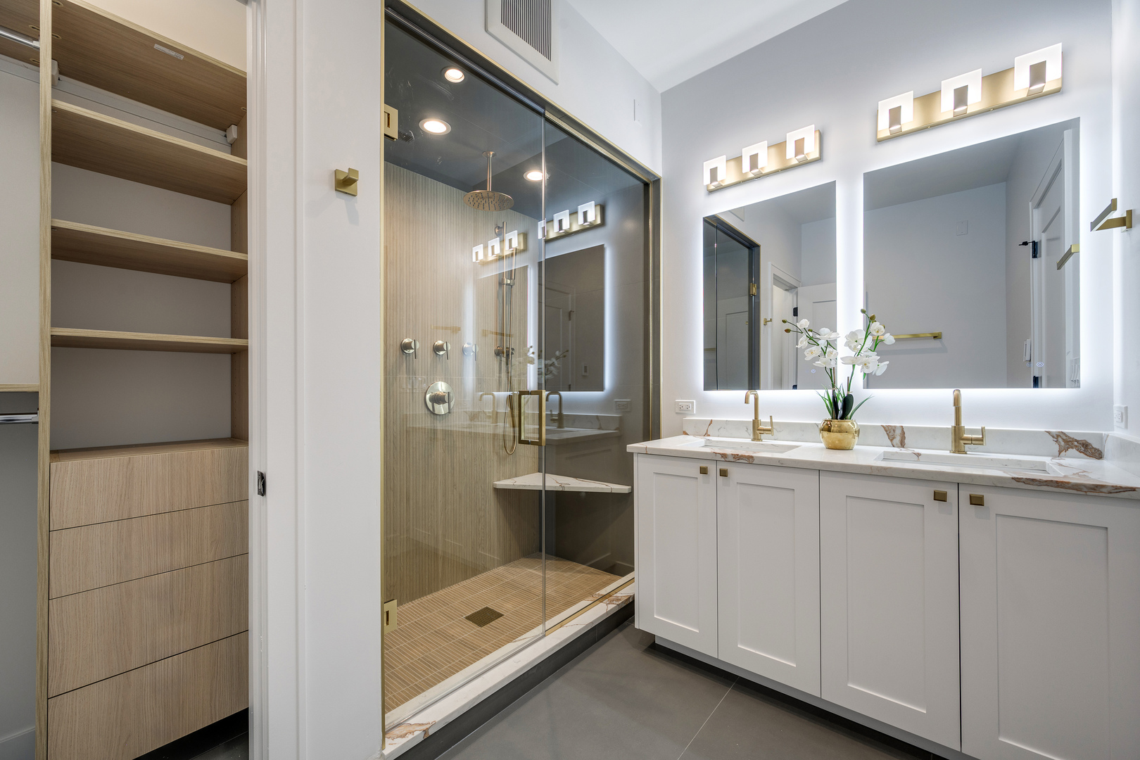 867 North Marshfield Avenue, Unit 2 Chicago, IL 60622 - Photo 13 of 19 a bathroom with a double vanity sink and a mirror
