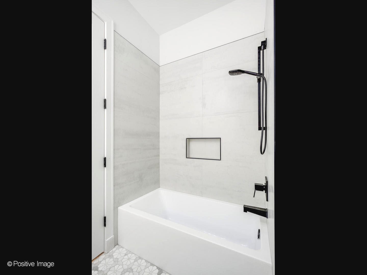 867 North Marshfield Avenue, Unit 2 Chicago, IL 60622 - Photo 18 of 19 a bathroom with a bathtub and a shower