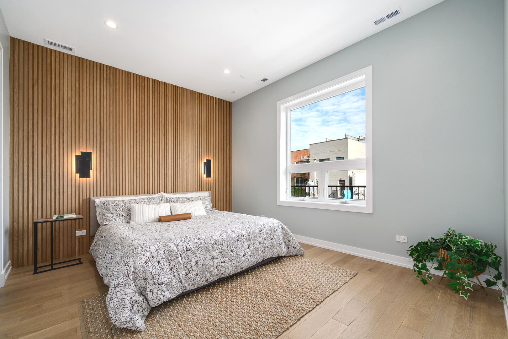 867 North Marshfield Avenue, Unit 2 Chicago, IL 60622 - Photo 10 of 19 a bedroom with a large bed and a window