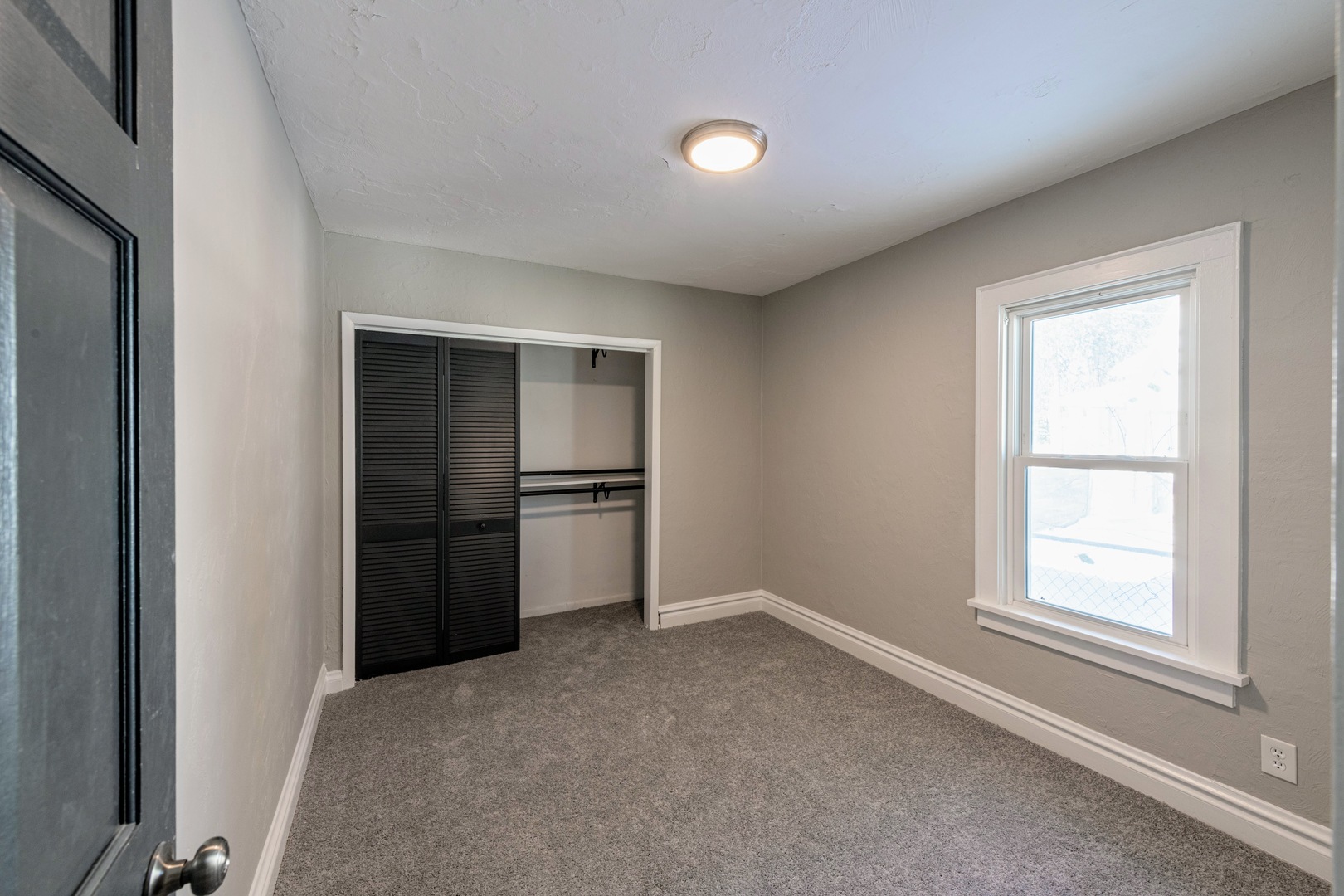 3017 Gabriel Avenue Zion, IL 60099 - Photo 12 of 23 an empty room with windows and refrigerator
