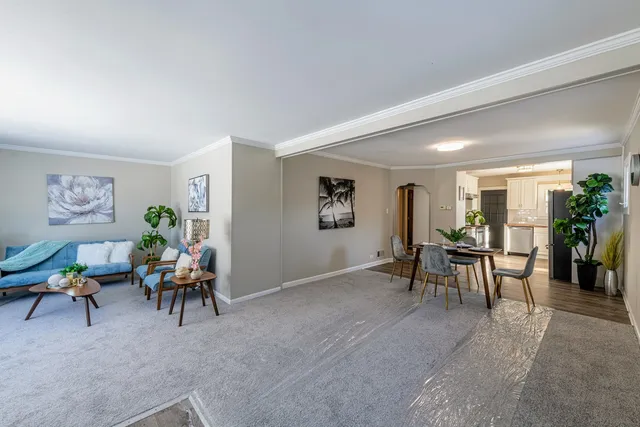a living room with furniture and a table