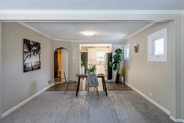 a dining room with furniture and window