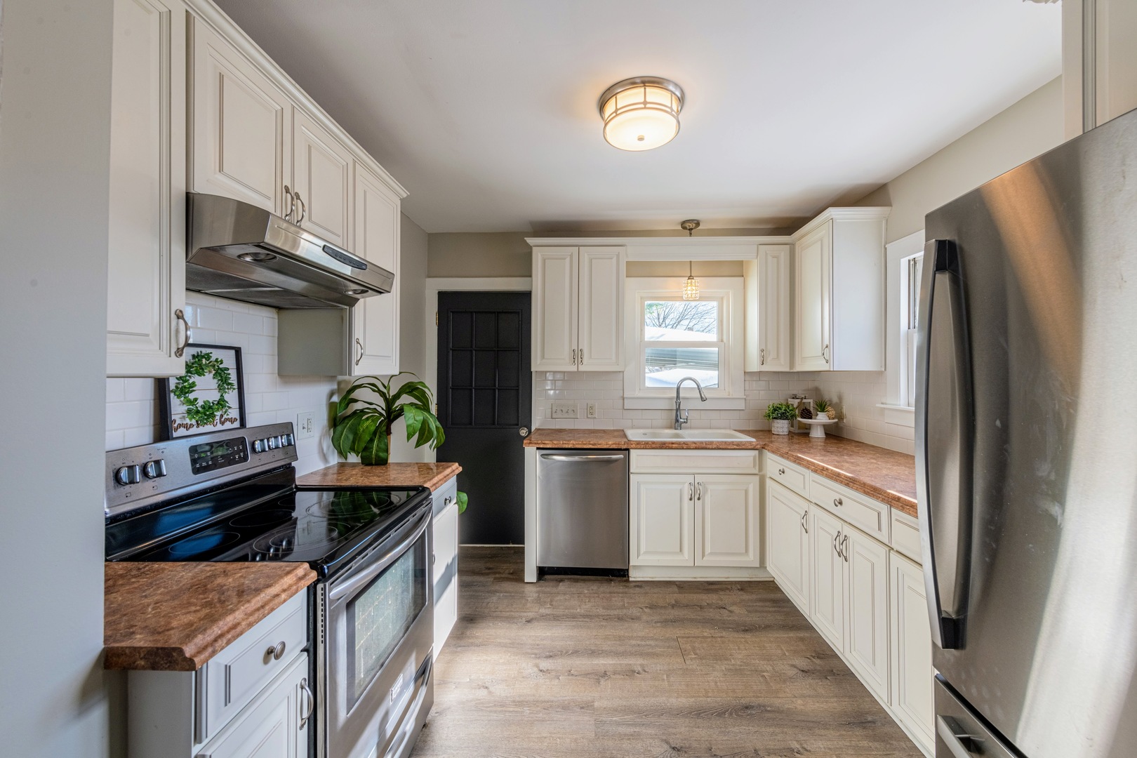 3017 Gabriel Avenue Zion, IL 60099 - Photo 8 of 23 a kitchen with stainless steel appliances granite countertop a stove a sink and a refrigerator