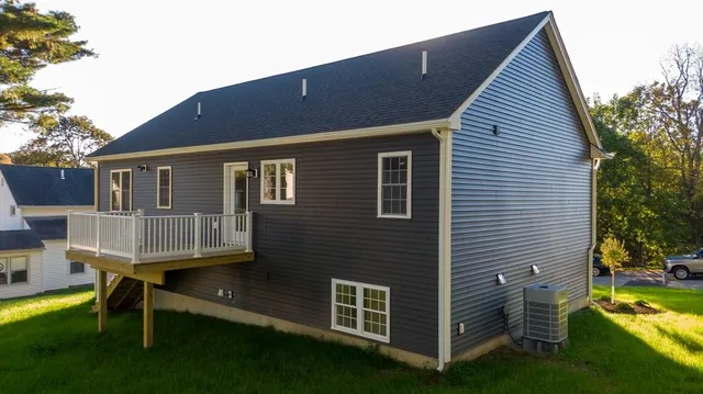 a view of backyard with a deck