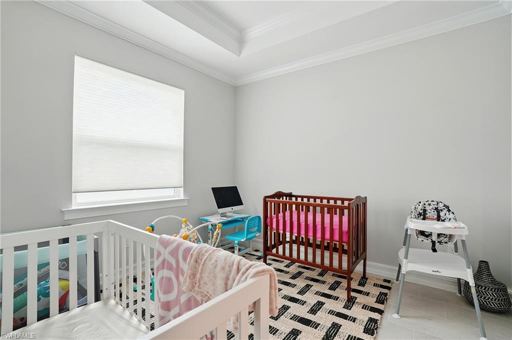 28165 Captiva Shell Loop Bonita Springs, FL 34135 - Photo 26 of 38 Laundry room featuring washer and dryer and cabinet space