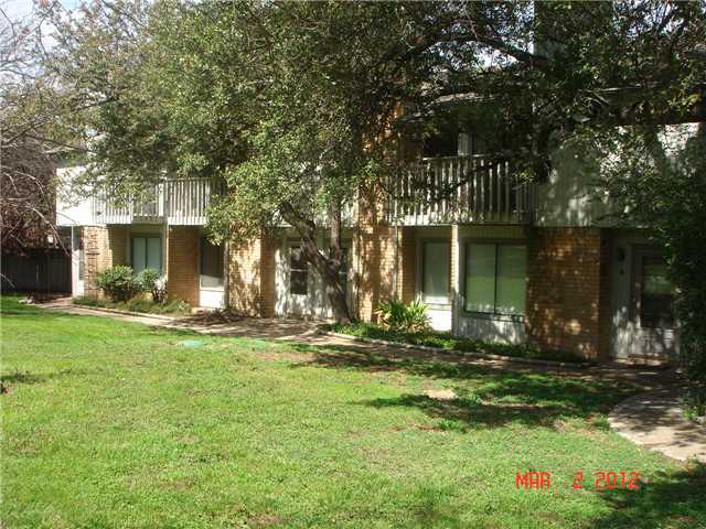 4204 Hudson Bend Road, Unit D Austin, TX 78734 - Photo 1 of 1 a front view of a house with garden