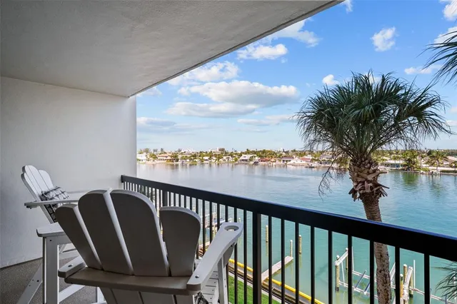 a view of a balcony with an outdoor seating