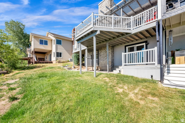 5057 South Ridgedale Drive Ogden, UT 84403 - Photo 8 of 69 Tiered outdoor living spaces with a multi-level deck featuring white railings and a lattice overhead covering