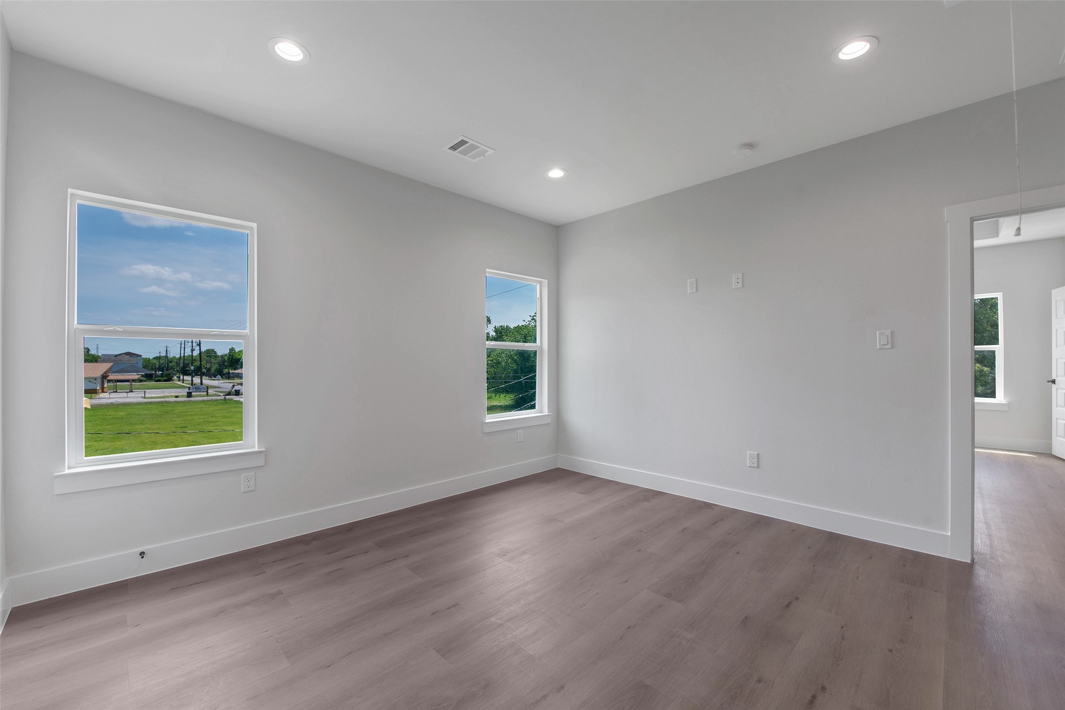 9311 Jutland Road Houston, TX 77033 - Photo 15 of 28 Another angle of the flexible upstairs space, showcasing its open feel and the convenient doorway leading directly to the primary suite.