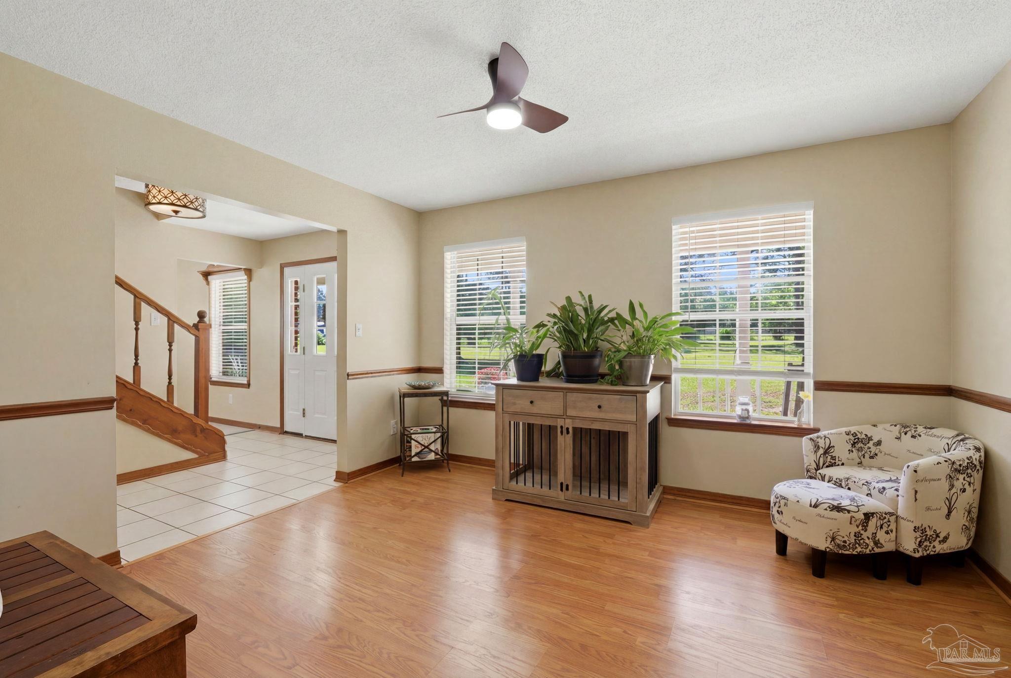 6870 Martin Road Milton, FL 32570 - Photo 7 of 48 a living room with furniture and a large window