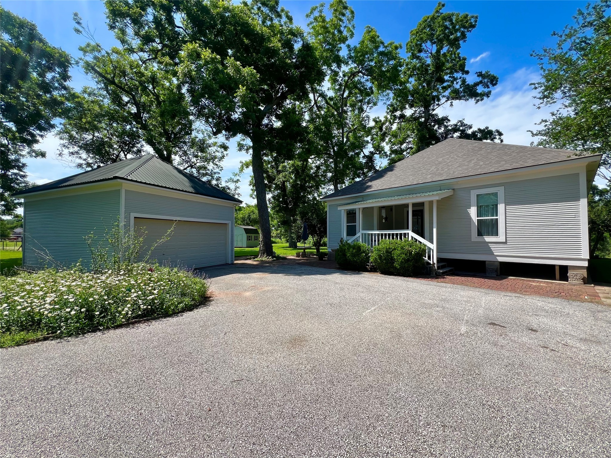 560 Jimmy Phillips Boulevard Angleton, TX 77515 - Photo 1 of 38 front view of a house with a garage