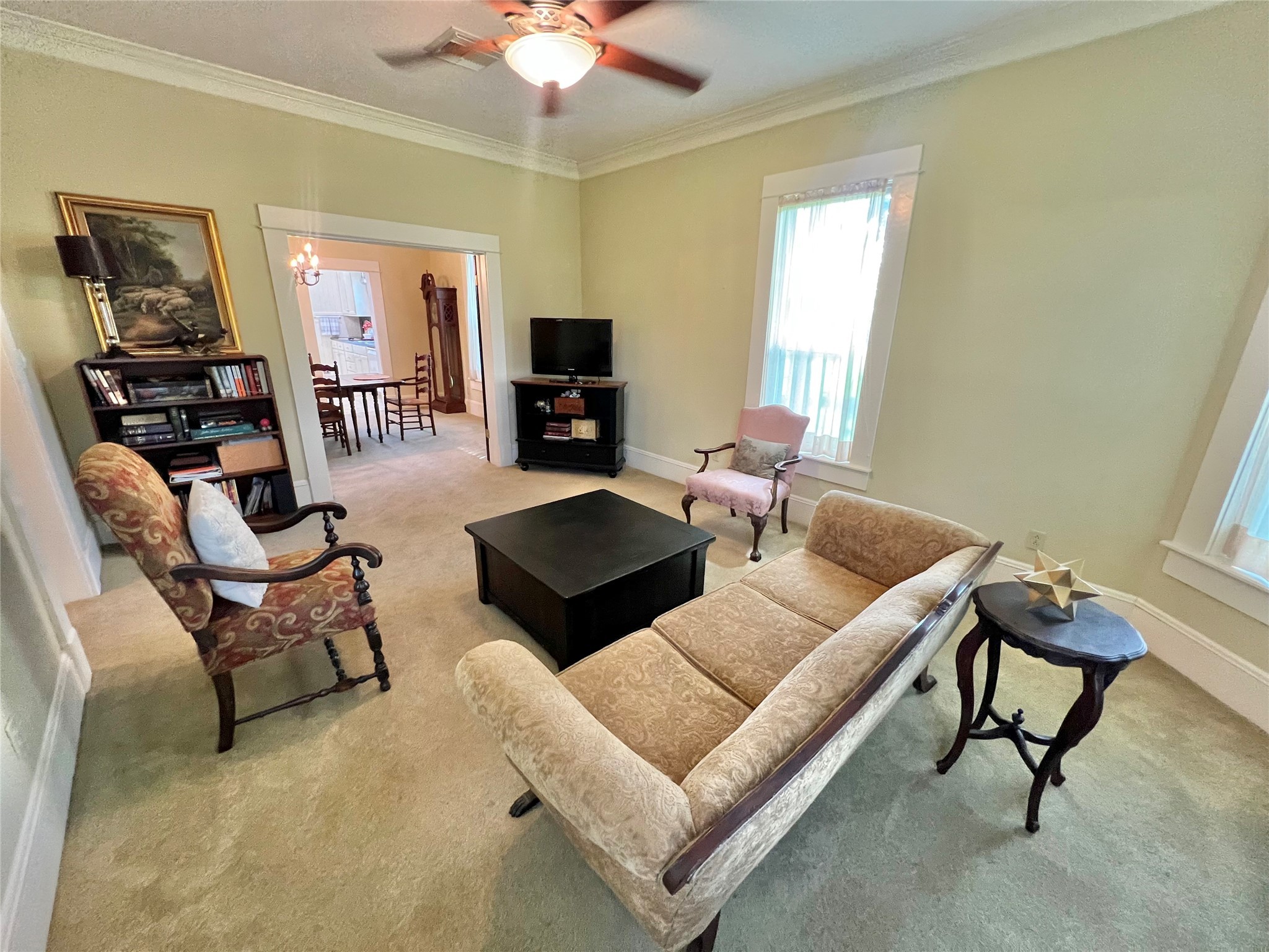 560 Jimmy Phillips Boulevard Angleton, TX 77515 - Photo 12 of 38 a living room with furniture and a chandelier