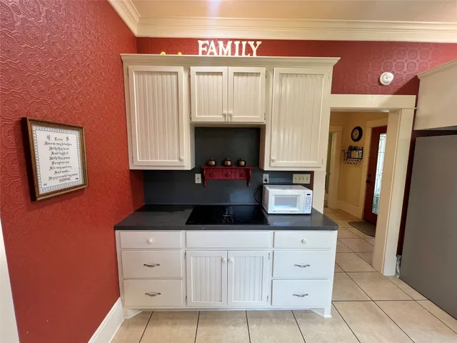 a kitchen with sink cabinets and stove