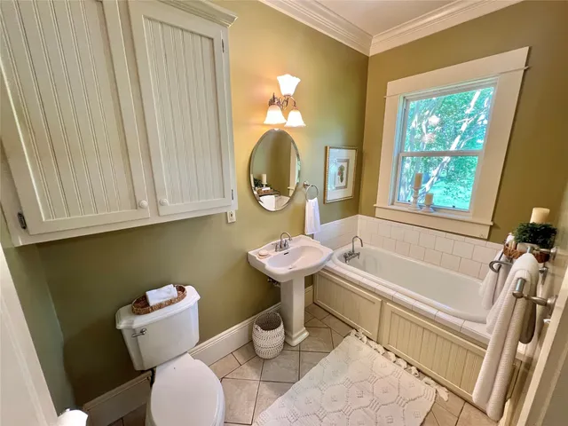 a bathroom with a sink a toilet and a bathtub