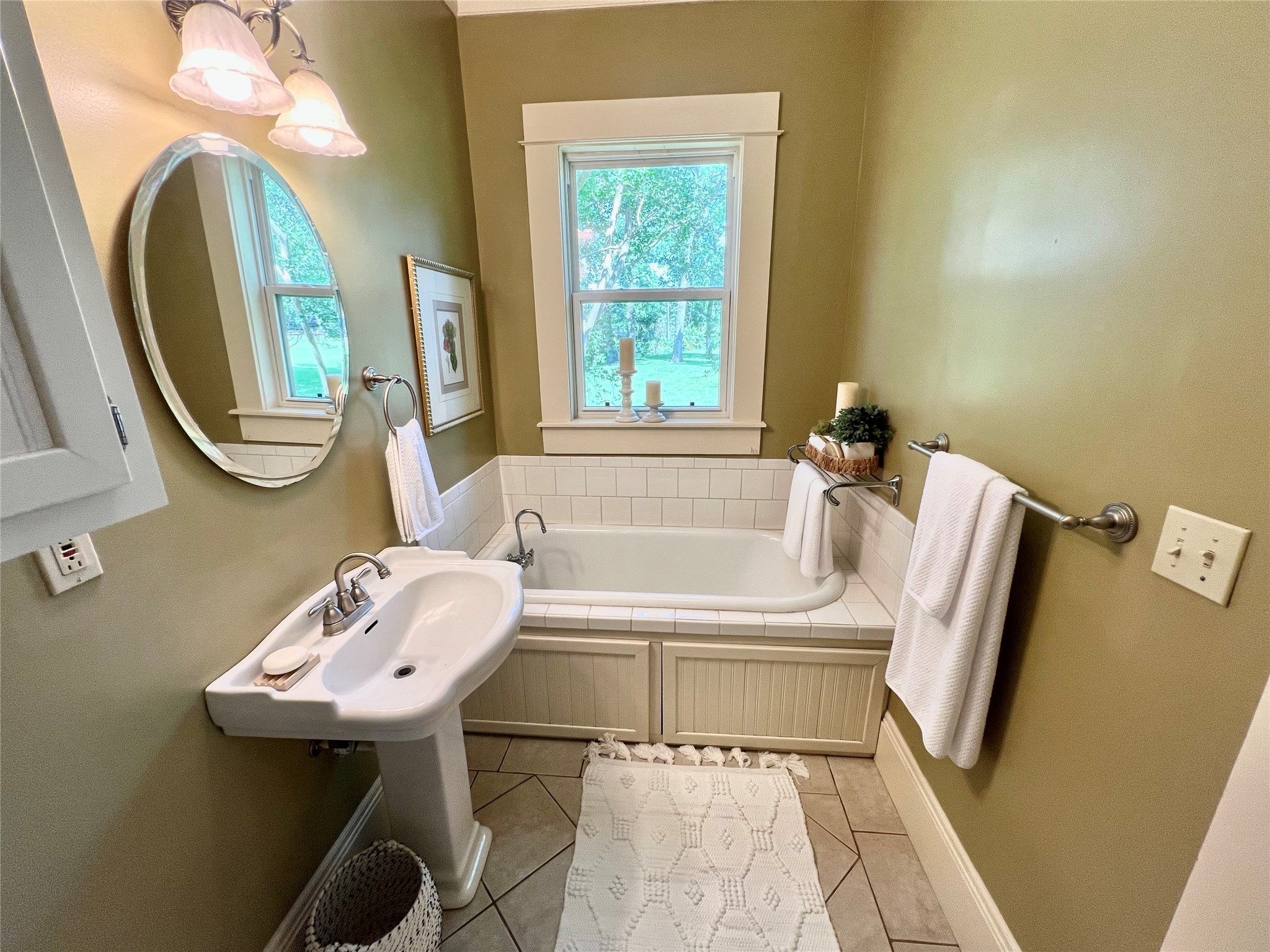 560 Jimmy Phillips Boulevard Angleton, TX 77515 - Photo 23 of 38 a bathroom with a sink a toilet and a mirror