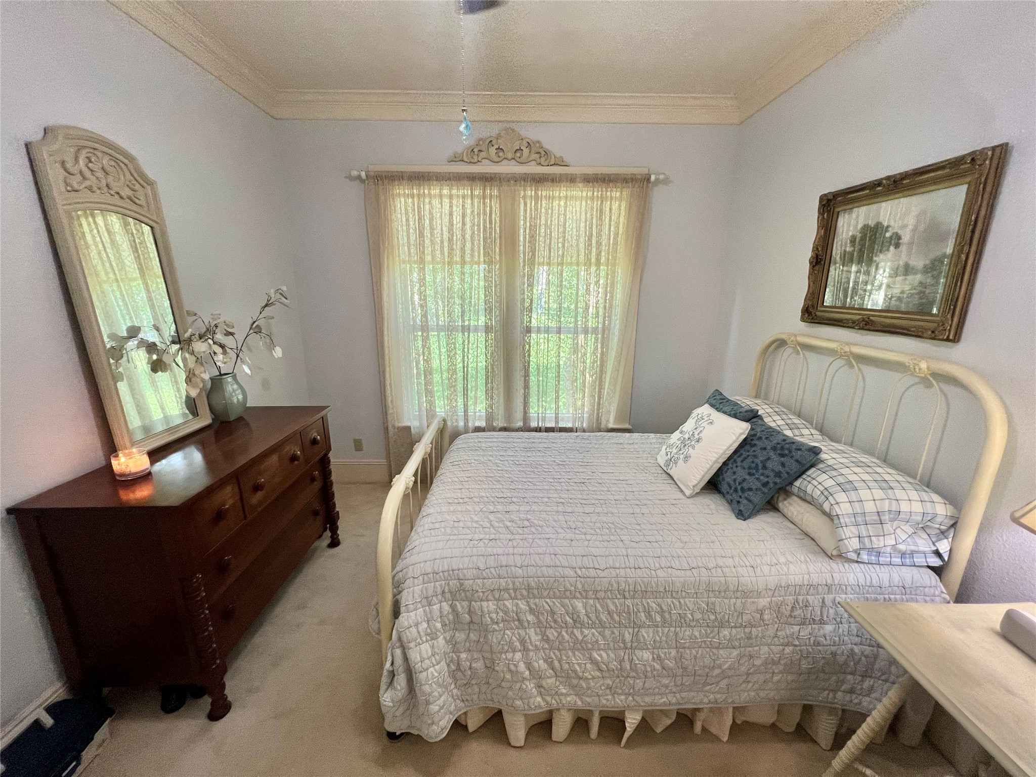 560 Jimmy Phillips Boulevard Angleton, TX 77515 - Photo 24 of 38 a bedroom with a bed and window