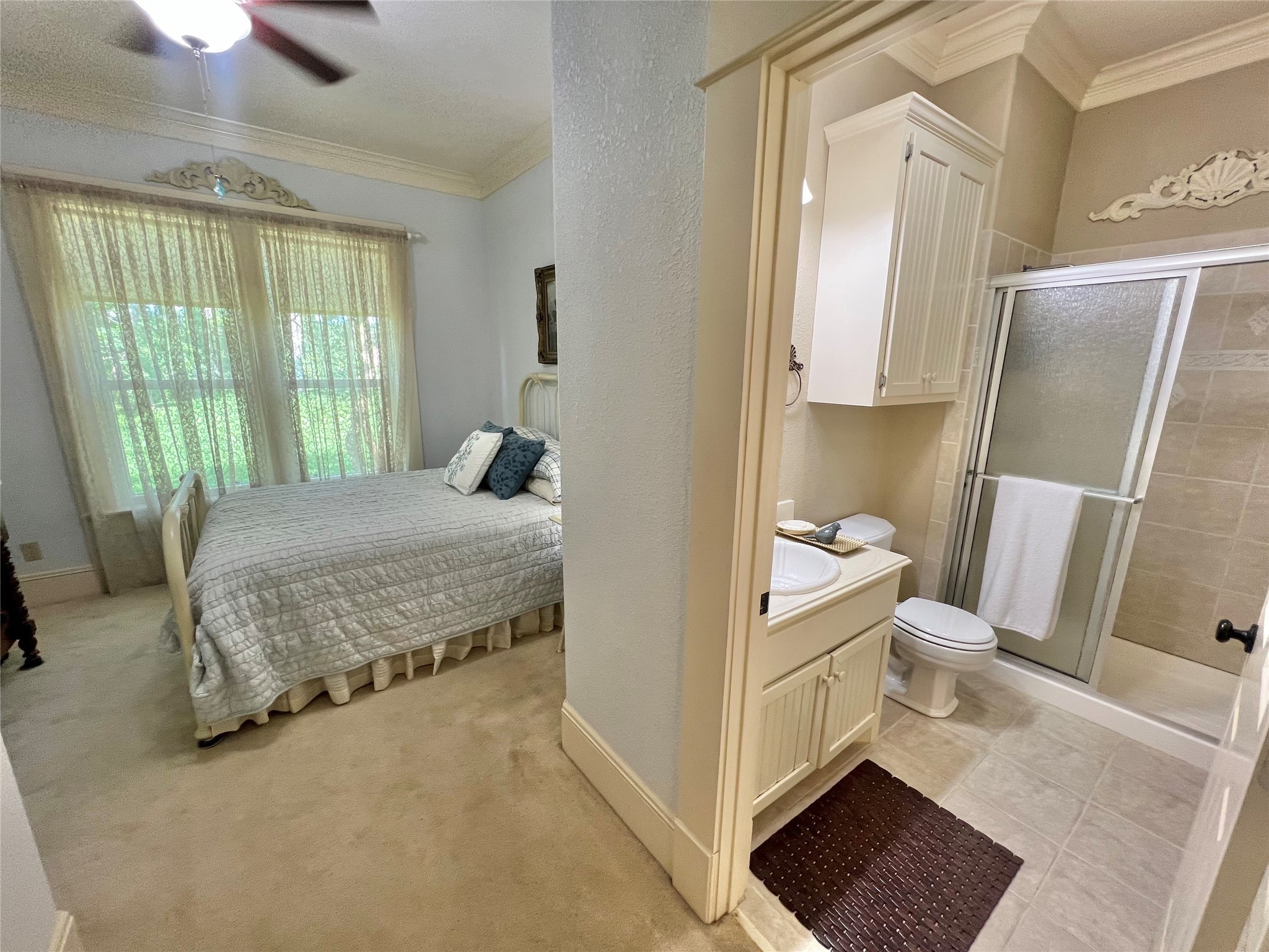 560 Jimmy Phillips Boulevard Angleton, TX 77515 - Photo 26 of 38 a bedroom with a bed and wooden floor