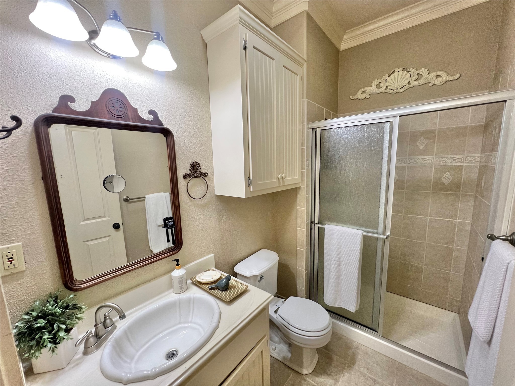 560 Jimmy Phillips Boulevard Angleton, TX 77515 - Photo 27 of 38 a bathroom with a sink mirror and toilet