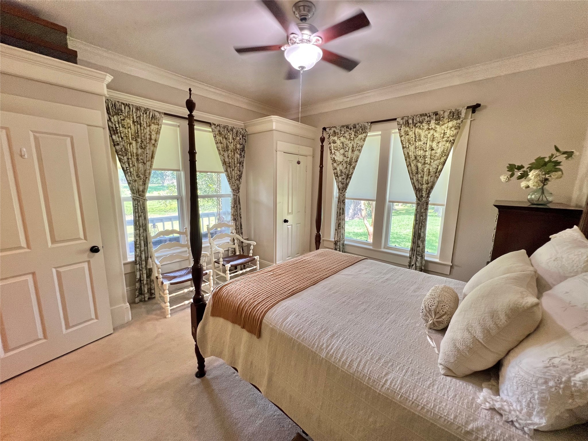 560 Jimmy Phillips Boulevard Angleton, TX 77515 - Photo 29 of 38 a bedroom with a large bed and a chandelier