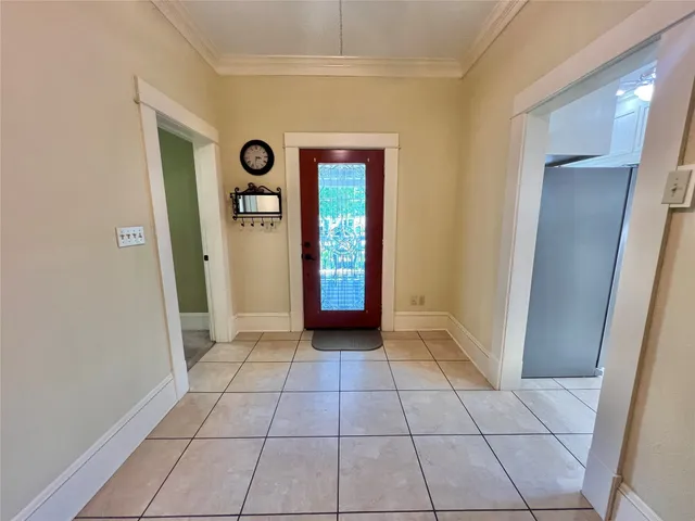 a view of an entryway with wooden floor