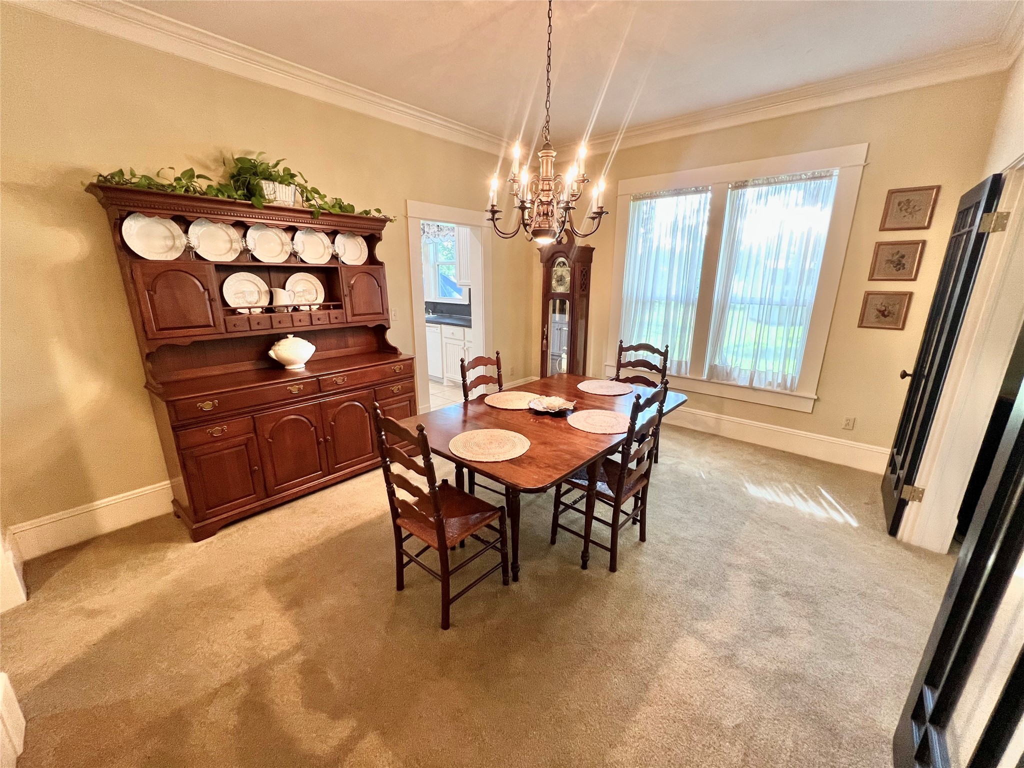 560 Jimmy Phillips Boulevard Angleton, TX 77515 - Photo 6 of 38 a view of a dining room with furniture and a chandelier