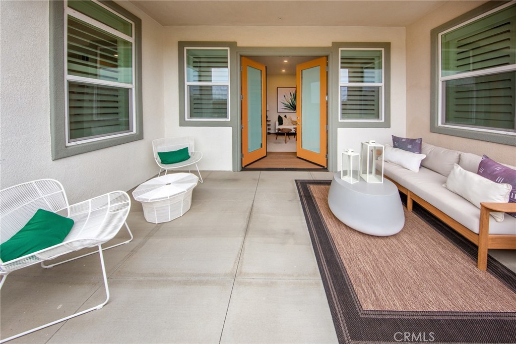 27466 Mercantile Court, Unit 101 Valencia, CA 91381 - Photo 9 of 21 a living room with furniture and windows