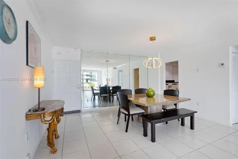 a view of a dining room furniture and chandelier