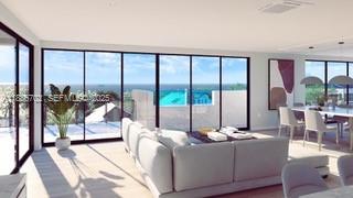 28597 Peg Leg Road Summerland Key, FL 33042 - Photo 12 of 20 a living room with large windows and a table