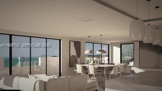 28597 Peg Leg Road Summerland Key, FL 33042 - Photo 15 of 20 a living room with furniture large windows and a chandelier