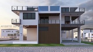 28597 Peg Leg Road Summerland Key, FL 33042 - Photo 2 of 20 a front view of a house with a garden